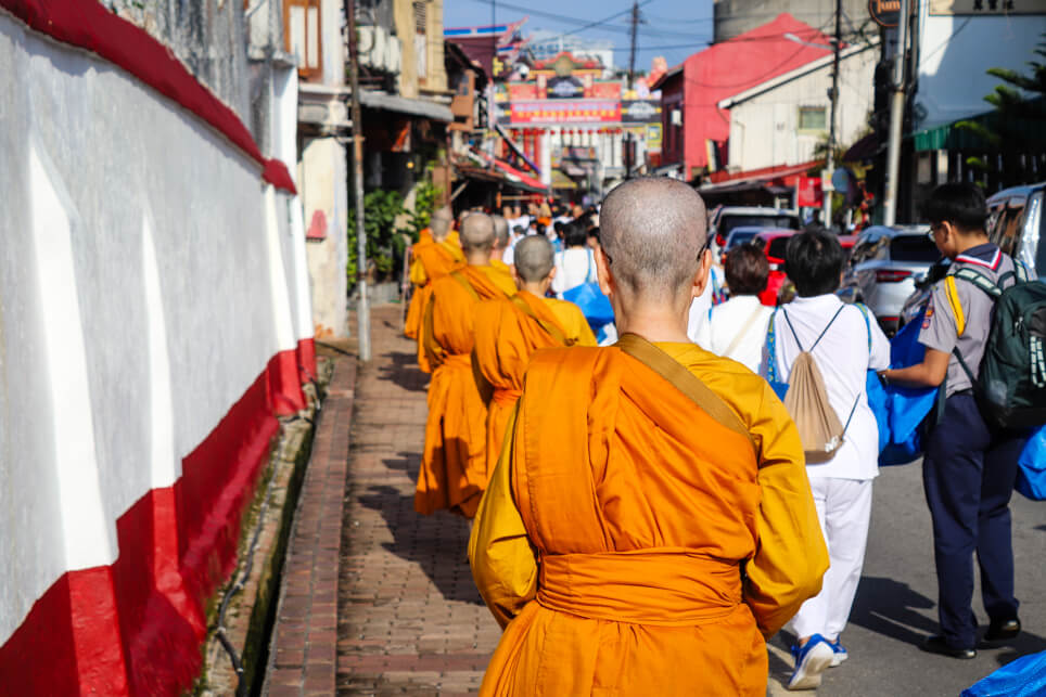 Monks on a parade at the street of Malacca Monks on a parade at the street of Malacca